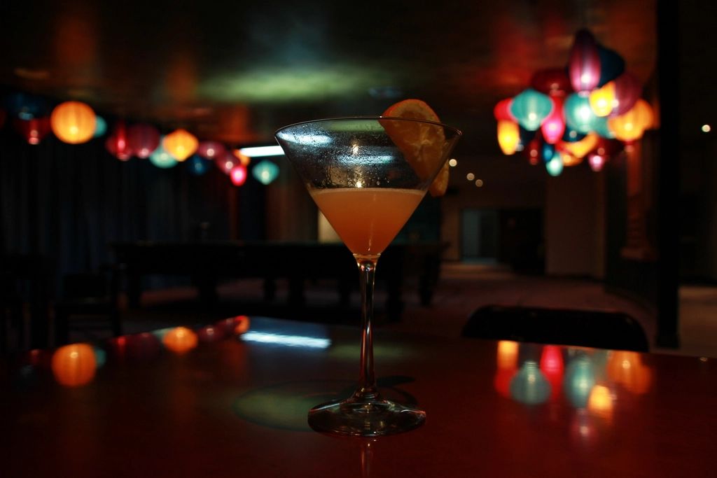 A cocktail being finished at the bar