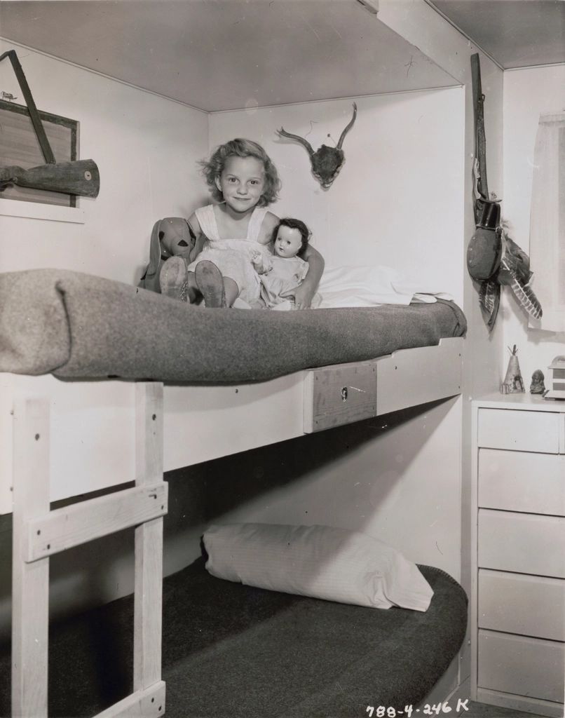 A guest room with two beds and a window